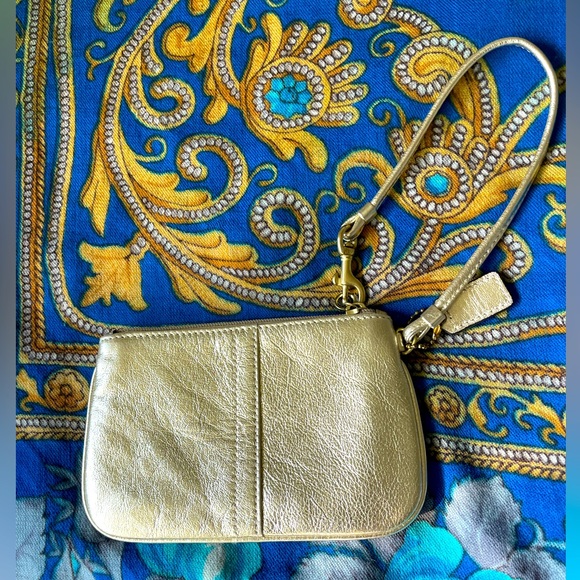 Coach Handbags - COACH gold wristlet  6 X 4 “ 🎈🎈